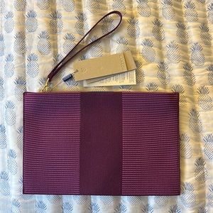 Rothy’s The Wristlet in Grape. NWT. Perfect condition.